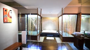 A modern bathroom with a large mirror, a bathtub, and a toilet. - The Thingaha Nay Pyi Taw (Naypyidaw)