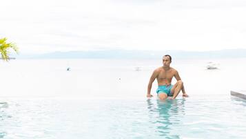 Outdoor pool, open 6:00 AM to 10:00 PM, sun loungers