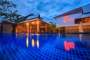 A hotel with a swimming pool, a covered outdoor area, and a prominent 'S48' sign. - S48 Hotel (Chiang Mai)