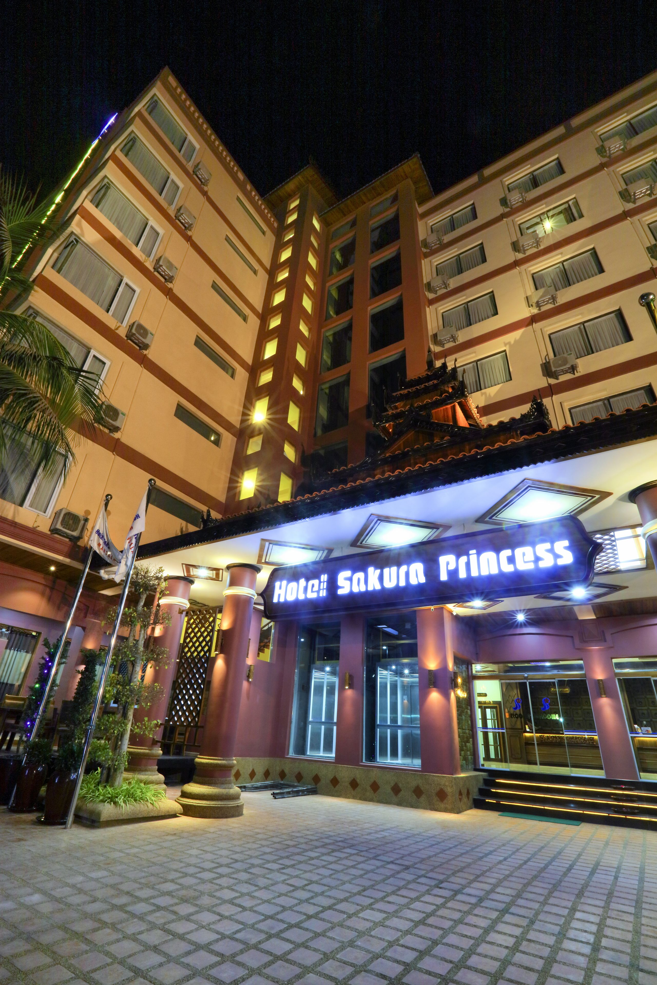 A hotel named "Hotel Sakura Princess" with a tiled entrance area and a visible entrance door.