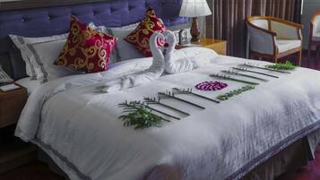 Egyptian cotton sheets, premium bedding, down duvets, minibar