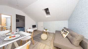 Standard Apartment, 1 Bedroom ( 2 ) | Living area | Flat-screen TV