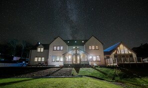 A two-story house with a starry night sky visible through the roof. - Redwood House Hotel (Skeabost)