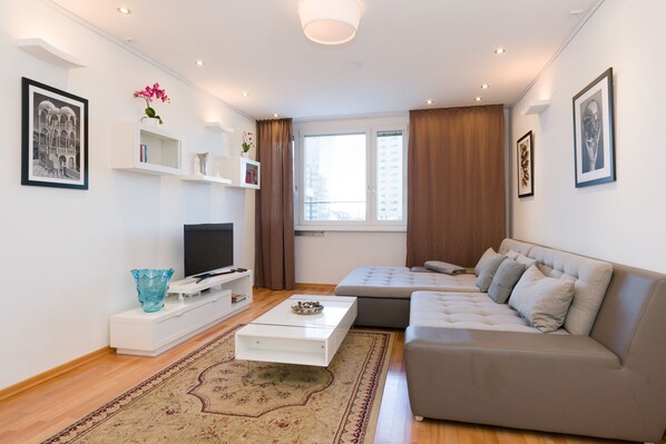 Design Condo, 1 Bedroom (Top 55) | Living area | Flat-screen TV