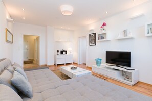 Design Condo, 1 Bedroom (Top 55) | Living area | Flat-screen TV