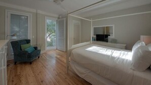 A bedroom with a bed, a chair, a ceiling fan, and a window with blinds. - Desire 4 Bedroom Holiday Home by Five Star Properties (Santa Rosa Beach)