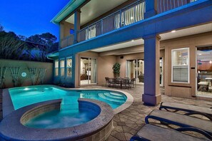 A two-story house with a swimming pool, outdoor seating, and a balcony. - Destiny Tranquility 5 Bedroom Holiday Home by Five Star Properties (Destin)