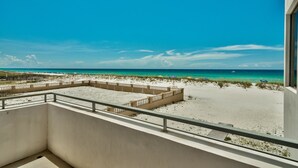 A balcony with a view of a beach and ocean. - The White House of Holiday Isle 6 Bedroom Holiday Home by Five Star Properties (Destin)