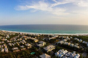 An aerial view of a coastal residential area with houses and a beach. - The White House of Watercolor 4 Bedroom Holiday Home by Five Star Properties (Santa Rosa Beach)