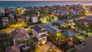An aerial view of a coastal residential area with houses, roads, and a beach. - Villa Destiny 6 Bedroom Holiday Home by Five Star Properties (Destin)