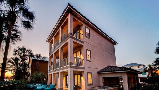 A multi-story residential building with a pool, balconies, and outdoor seating. - Villa Destiny 6 Bedroom Holiday Home by Five Star Properties (Destin)