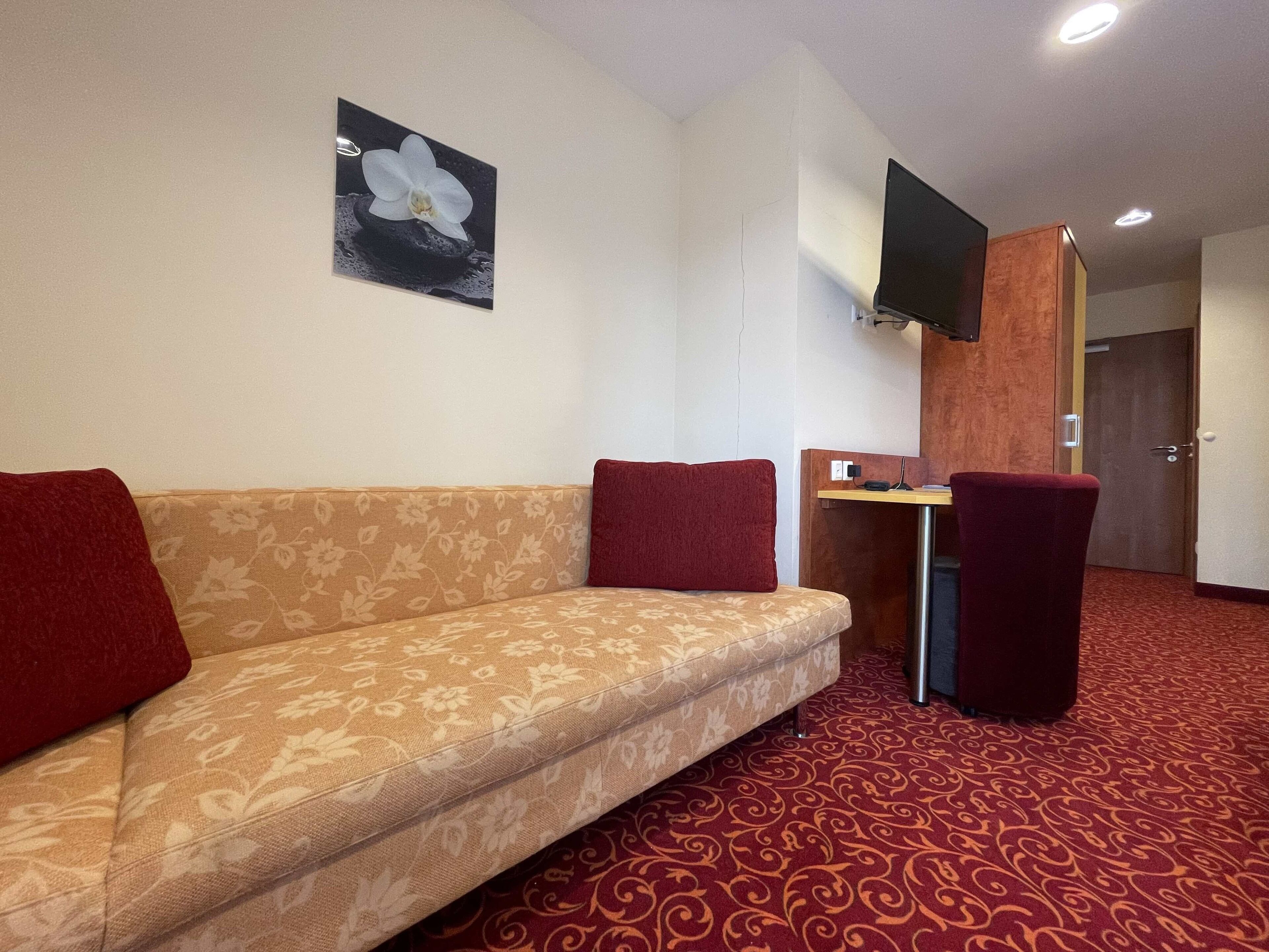 triple room, balcony | living area | flat-screen tv