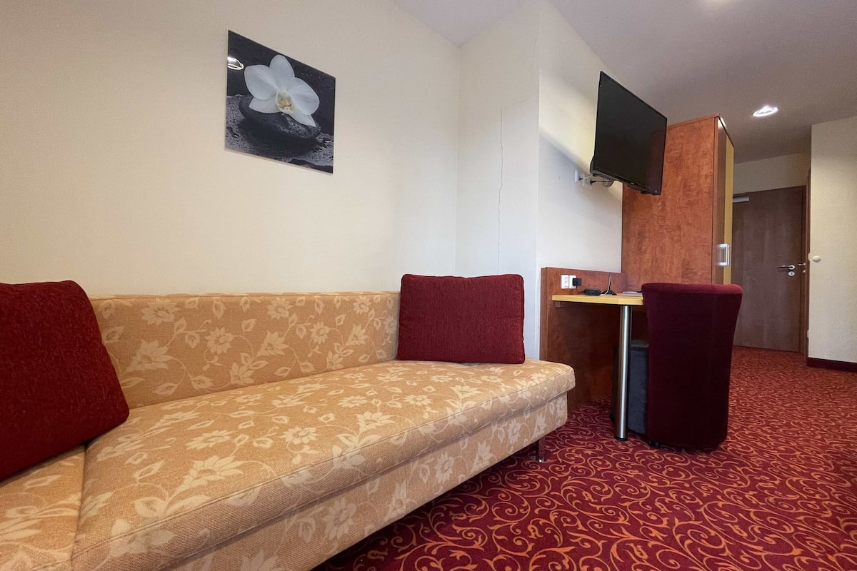 triple room, balcony | living area | flat-screen tv