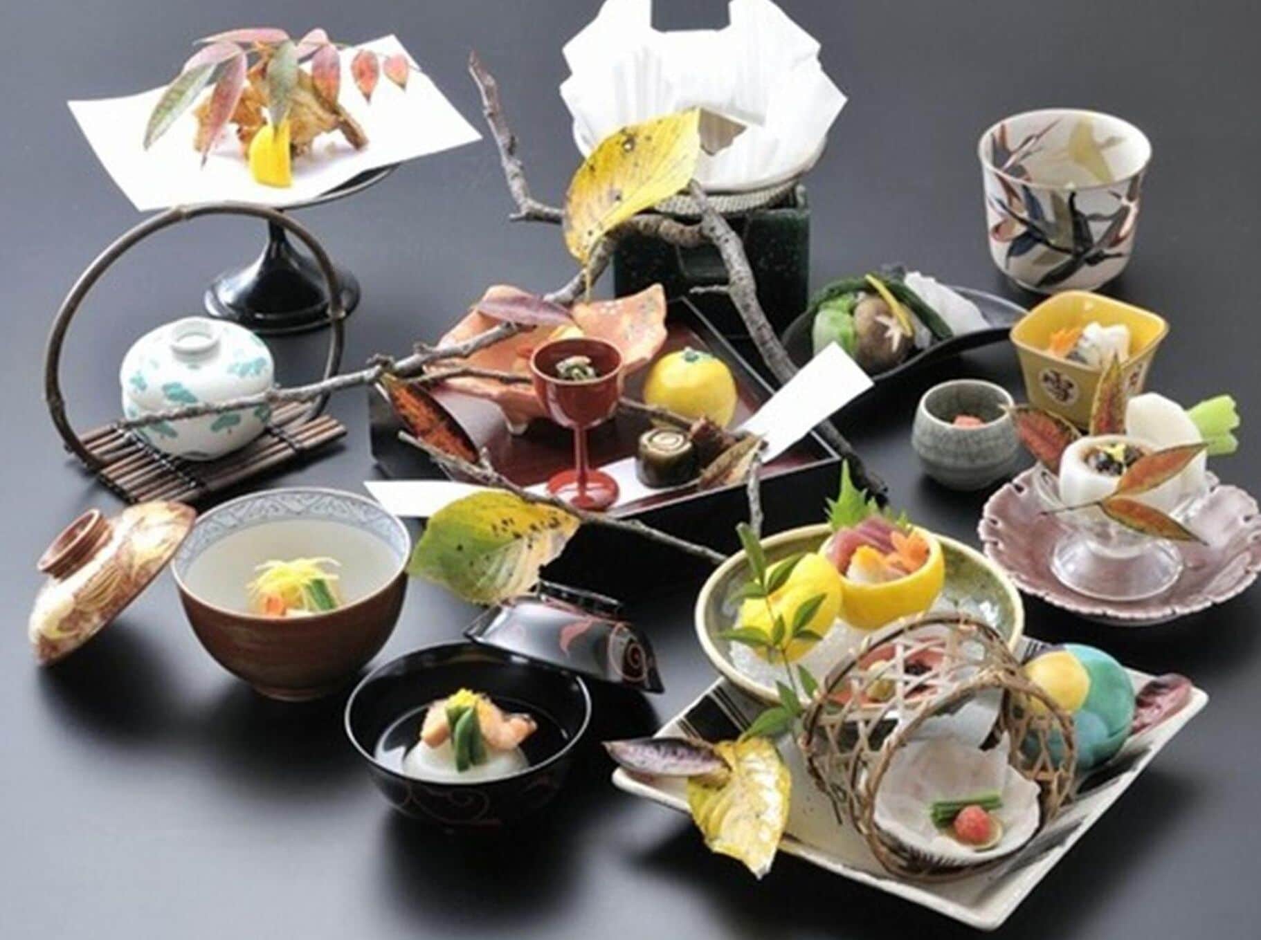 A variety of traditional Japanese dishes and utensils displayed on a table.