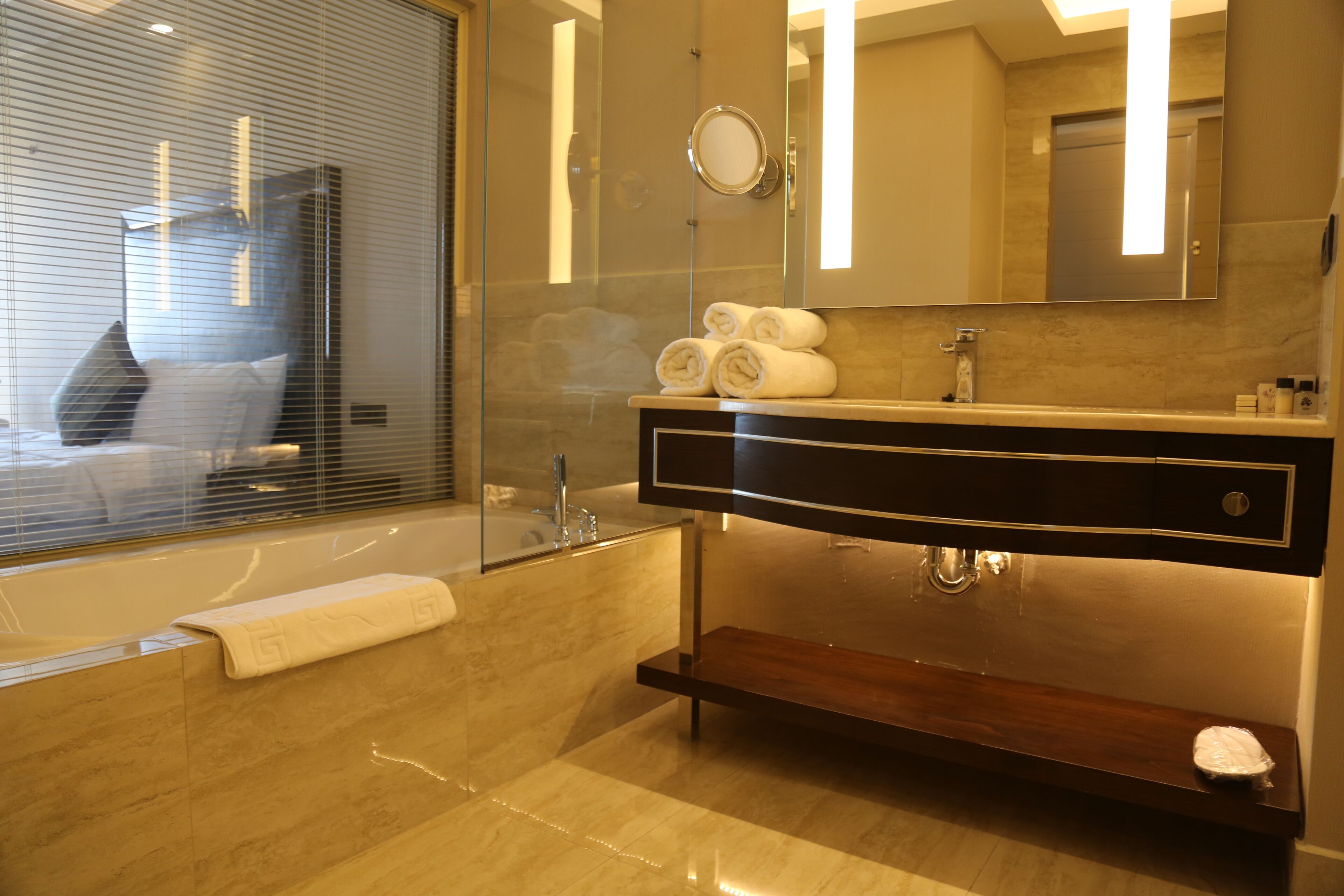 deep-soaking bathtub, hair dryer, slippers, towels