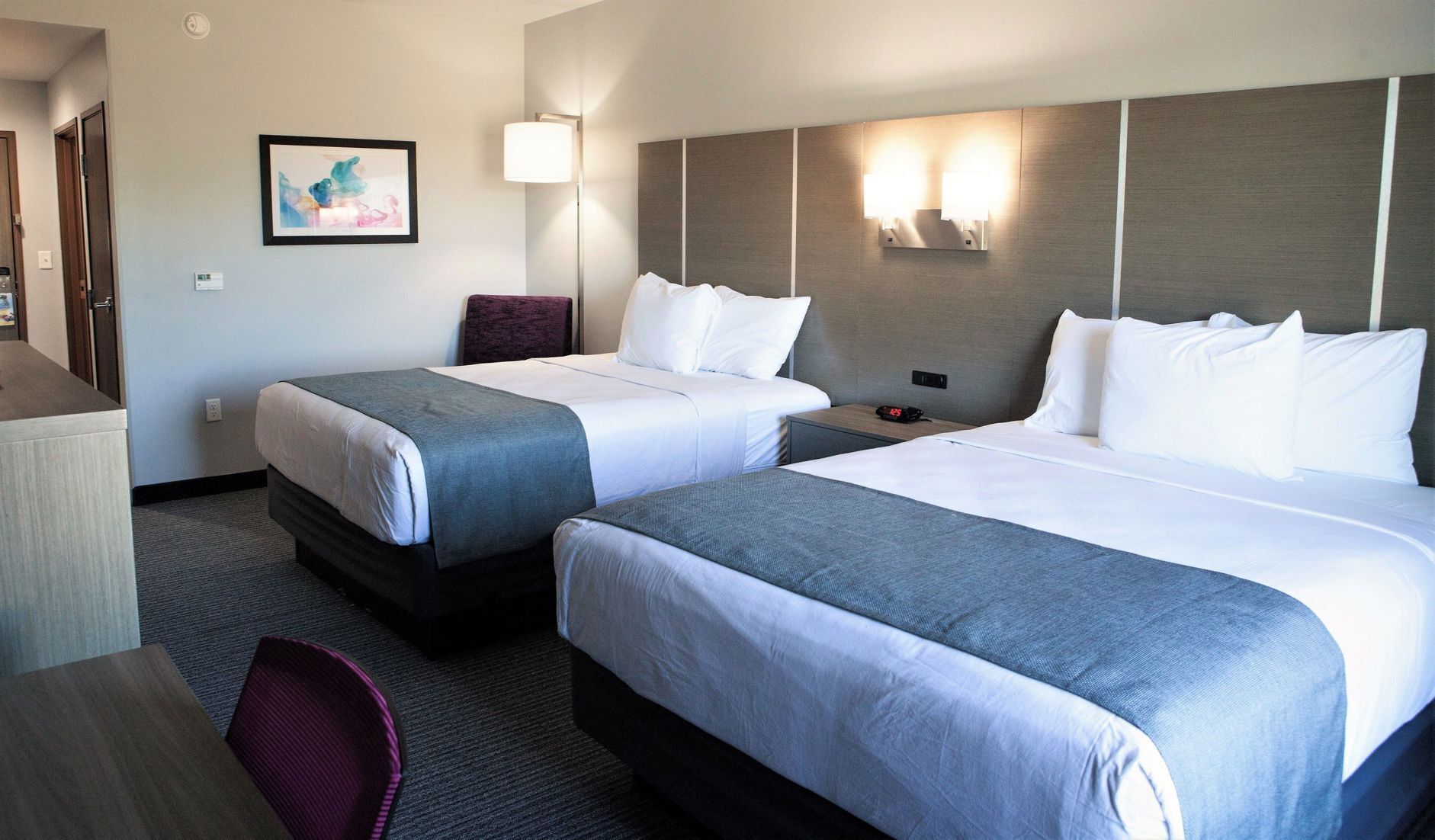Premium bedding, pillowtop beds, desk, laptop workspace