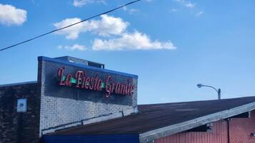A building with a sign that reads 'La Fiesta Grande.'