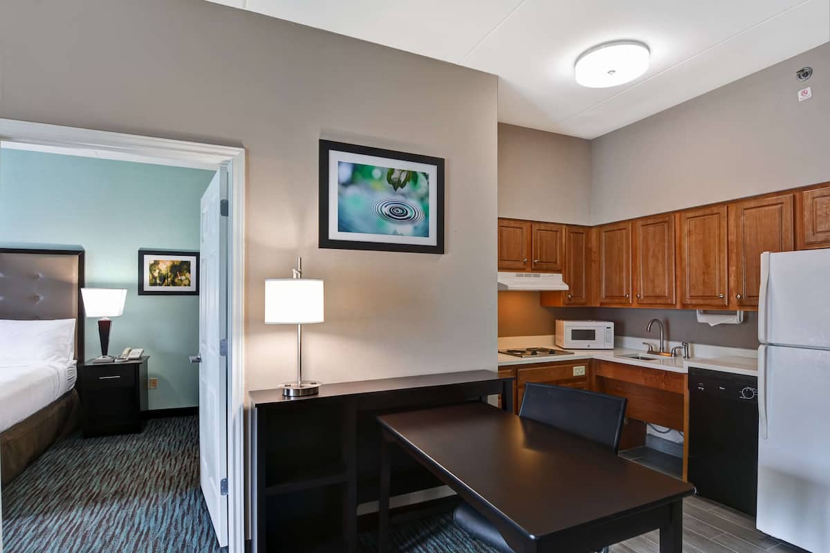 Premium bedding, desk, laptop workspace, blackout curtains