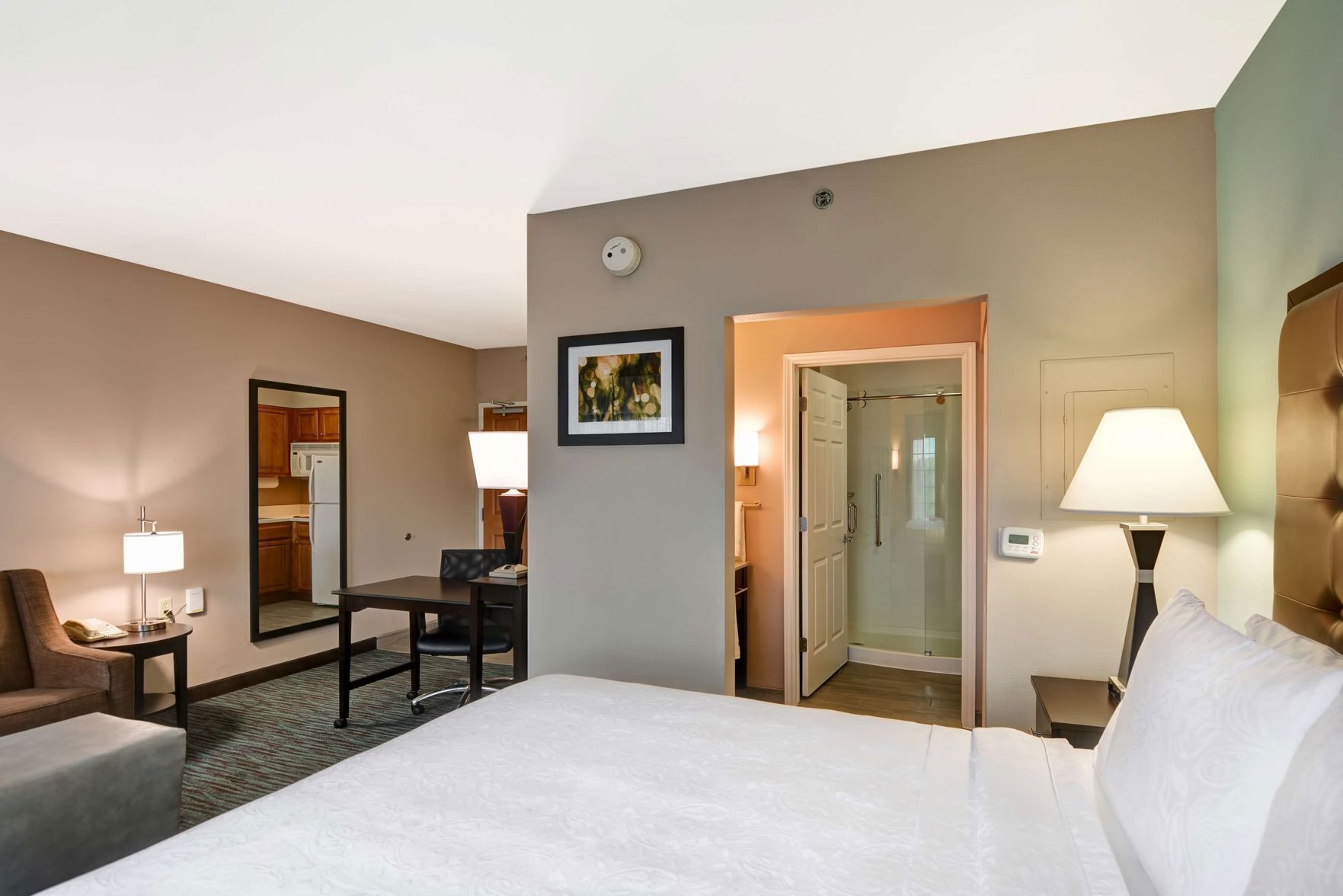 Premium bedding, desk, laptop workspace, blackout curtains