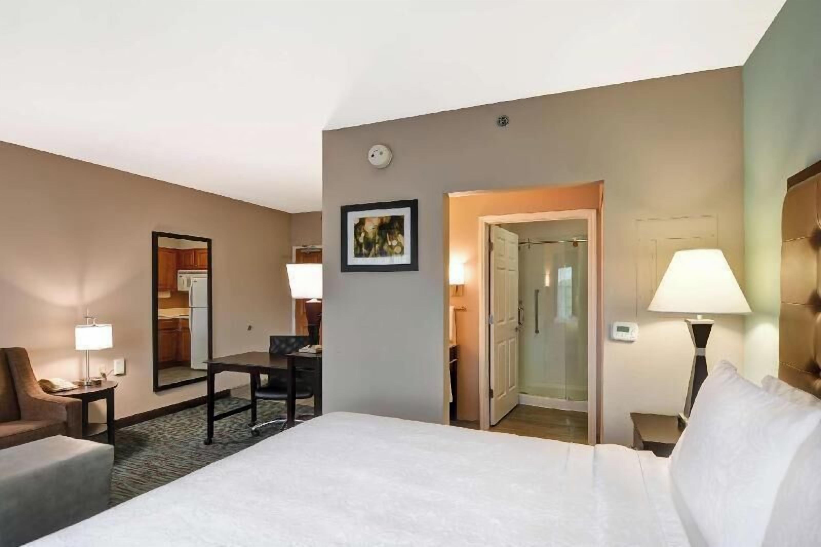 Premium bedding, desk, laptop workspace, blackout curtains