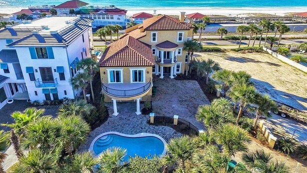 A large, multi-story house with a pool, surrounded by palm trees and a beach view. - Sea Span 6 Bedroom Holiday Home by Five Star Properties (Destin)