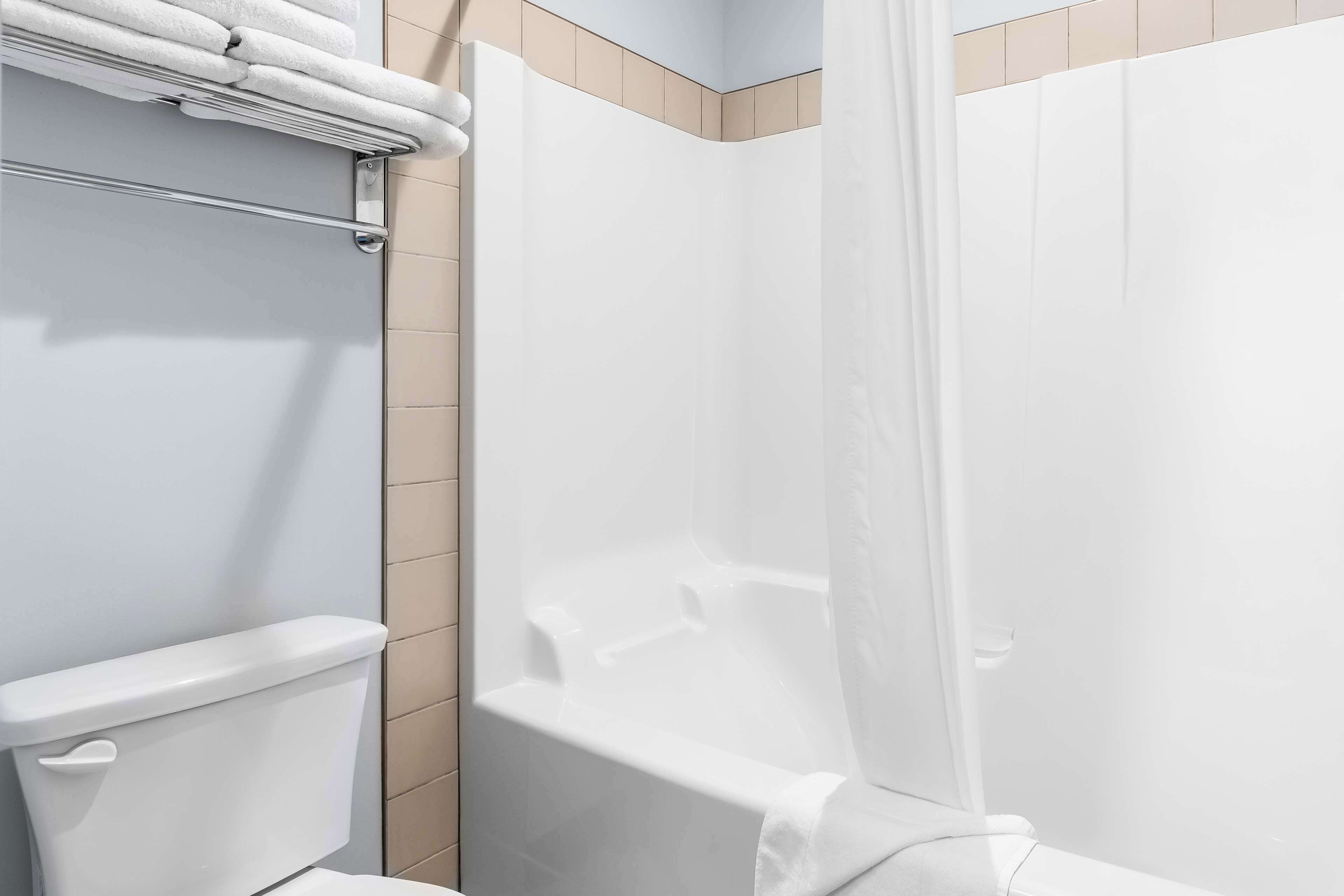 standard room, 2 queen beds, non smoking, kitchenette (dining table) | bathroom | combined shower/bathtub, hair dryer, towels, soap