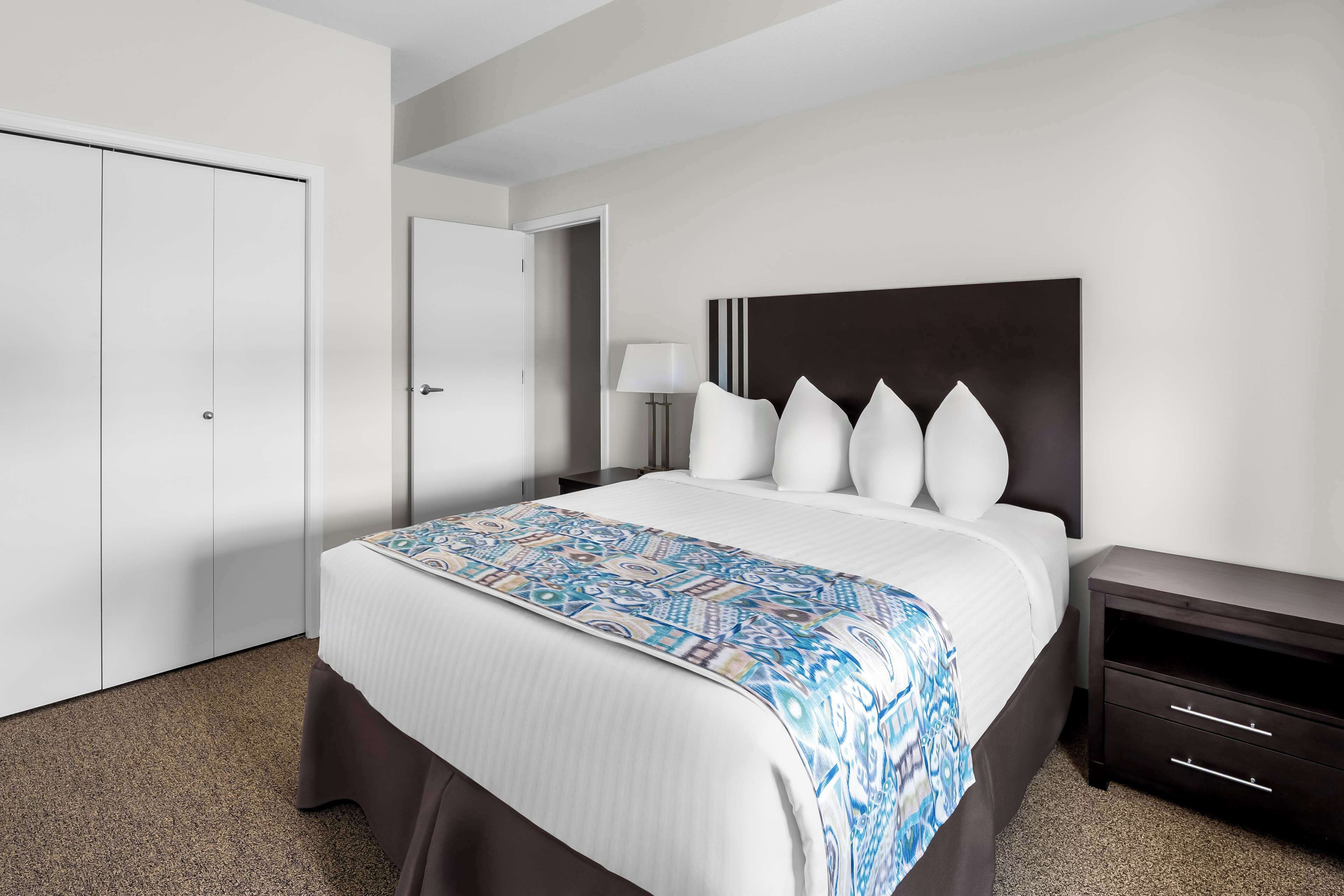 executive suite, 2 queen beds, kitchen, ground floor | individually furnished, blackout curtains, free wifi, bed sheets