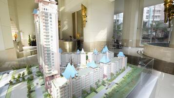 A model of a residential complex with multiple high-rise buildings, a central plaza, and surrounding greenery.