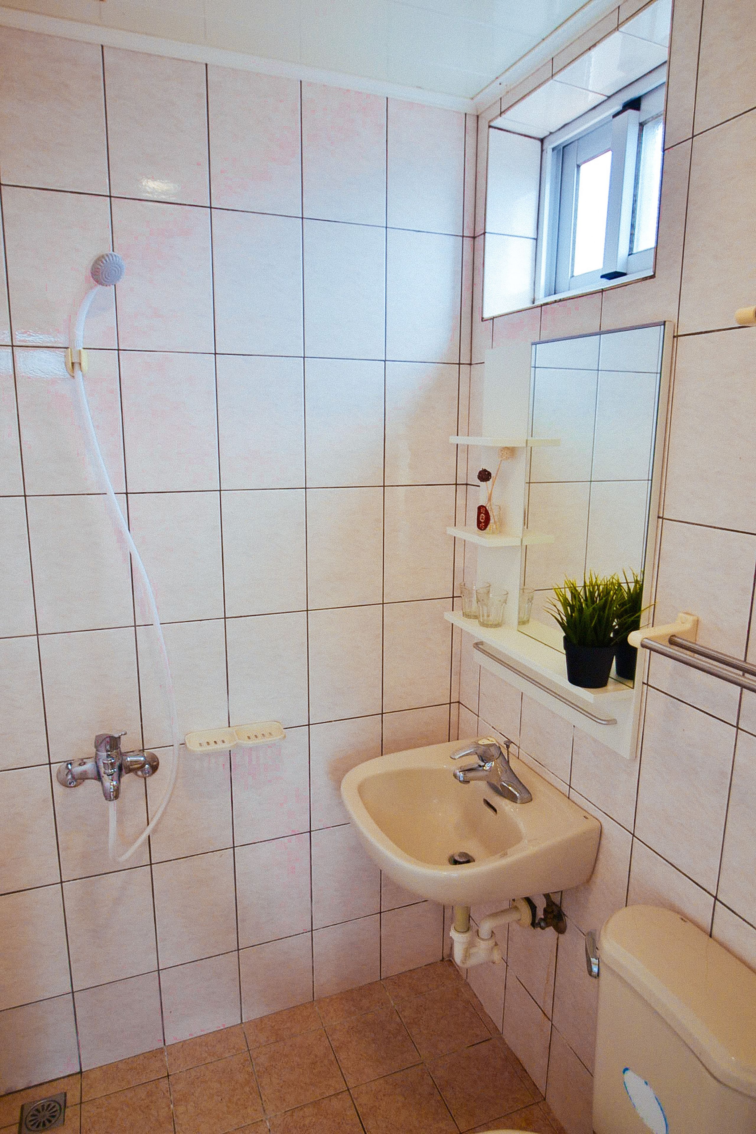 Shower, free toiletries, hair dryer, slippers