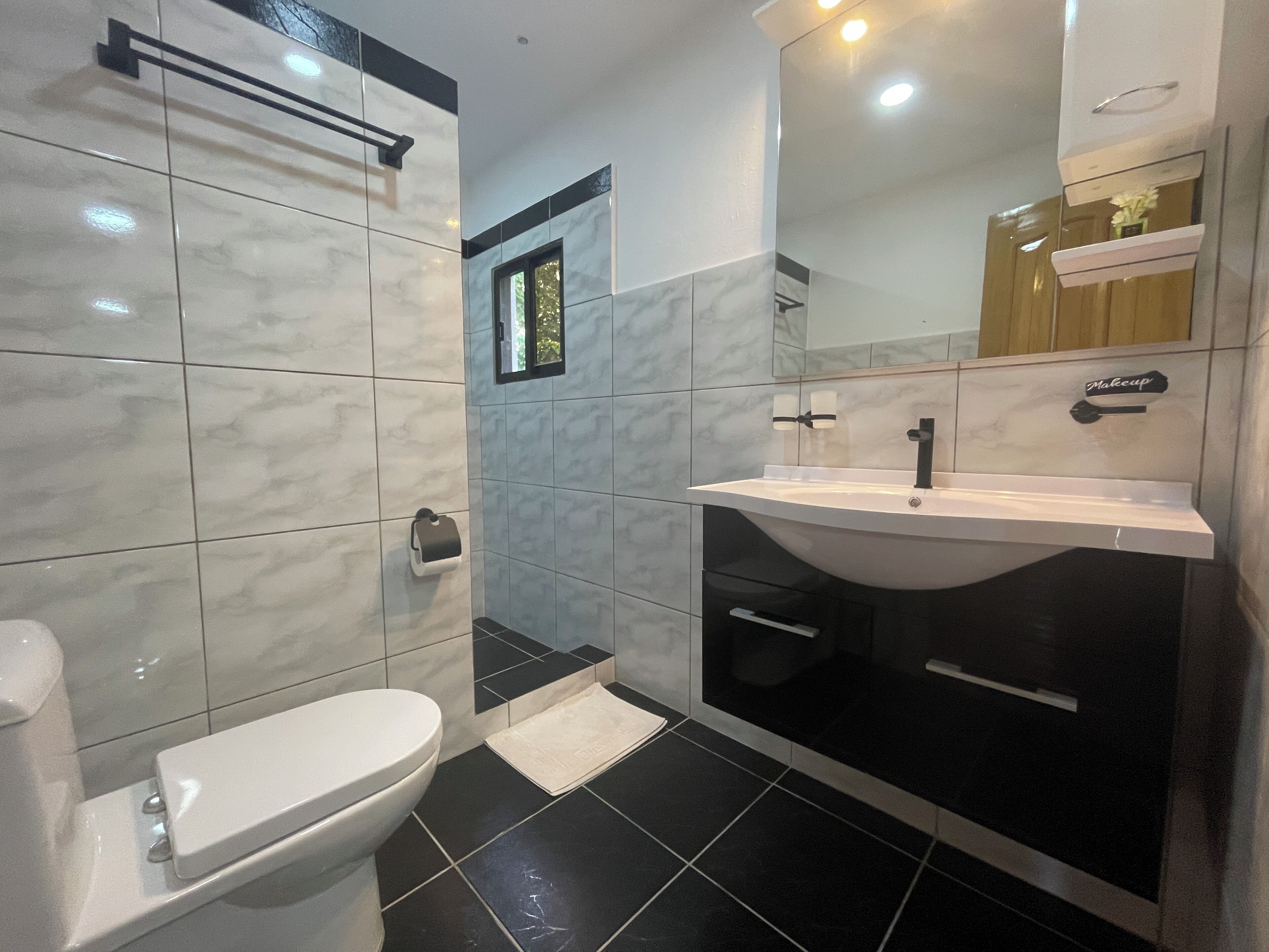 premium quadruple room | bathroom | shower, rainfall showerhead, designer toiletries, hair dryer