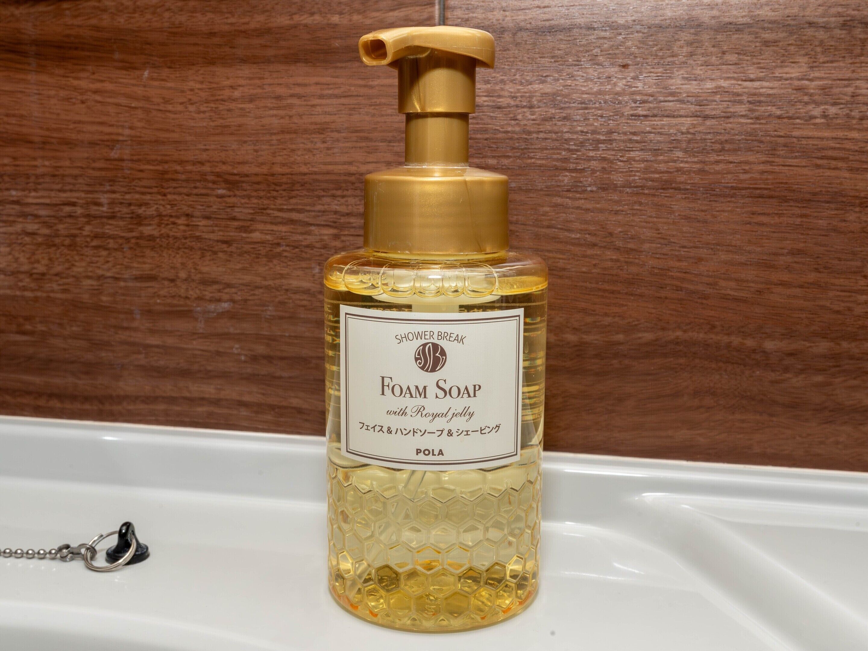 A bottle of shower break foam soap with a pump dispenser.