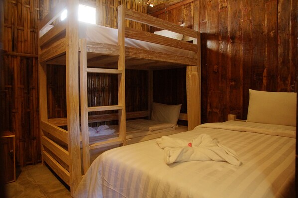 A wooden bunk bed room with a single bed and a bunk bed. - Beach Camp (Gili Trawangan)