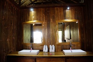 A wooden bathroom with two sinks, each with a mirror above. - Beach Camp (Gili Trawangan)