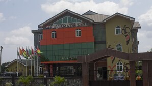 A hotel with a prominent sign reading "Grand Star Hotel". - Grand Star Hotel (Accra)