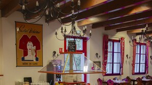 A buffet setup with various food items and a decorative chandelier. - Les Loges de l'Ecomusée D'Alsace (Ungersheim)