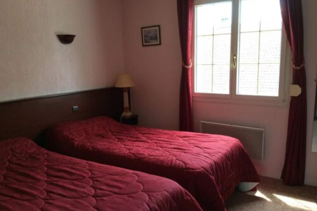 Twin Room | In-room safe, desk, iron/ironing board (on request), cribs (free)