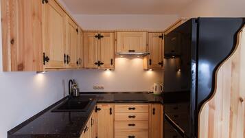 Apartment, 1 Bedroom | Private kitchen | Full-size fridge, microwave, stovetop, dishwasher