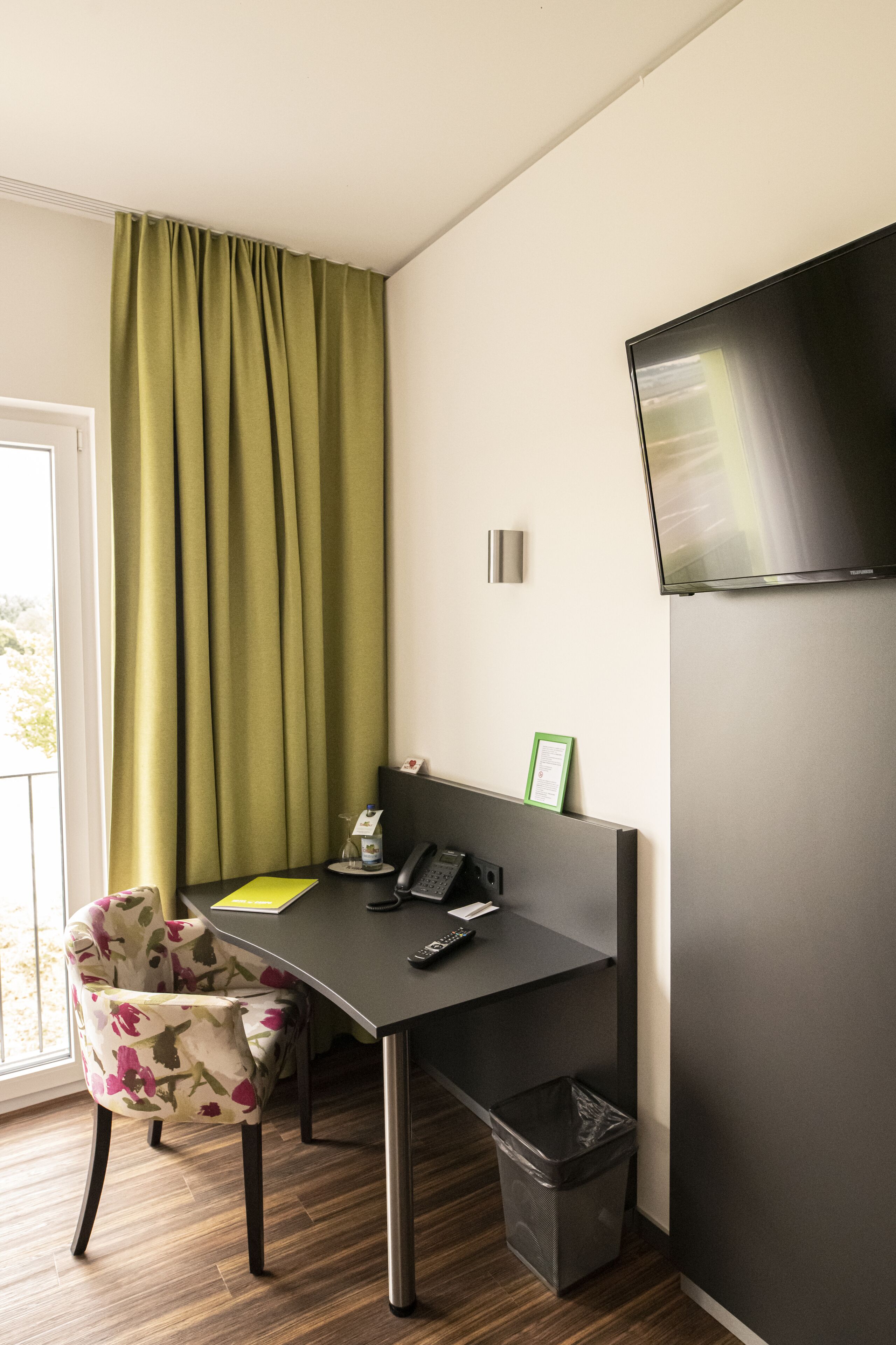 single room | living area | flat-screen tv