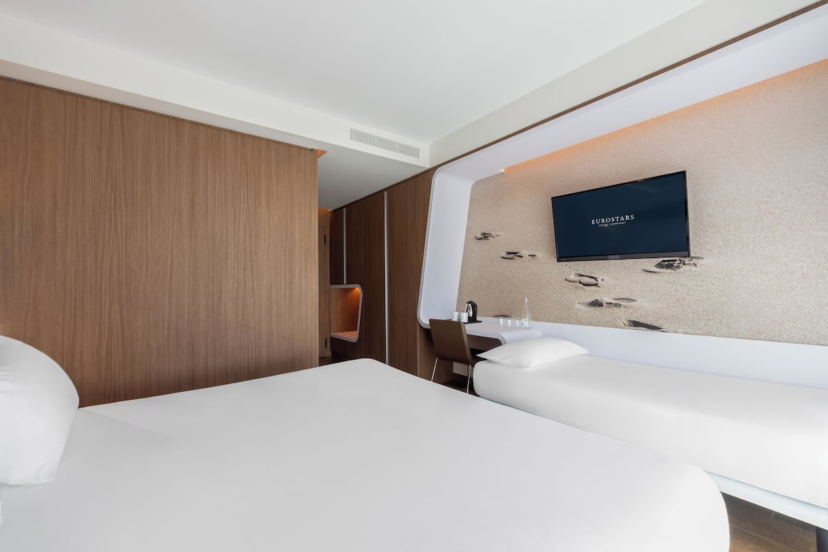 Triple Room, City View | 1 bedroom, in-room safe, individually furnished, desk