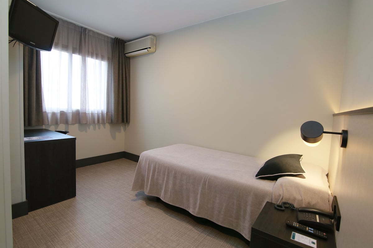 single room | in-room safe, desk, blackout curtains, free wifi