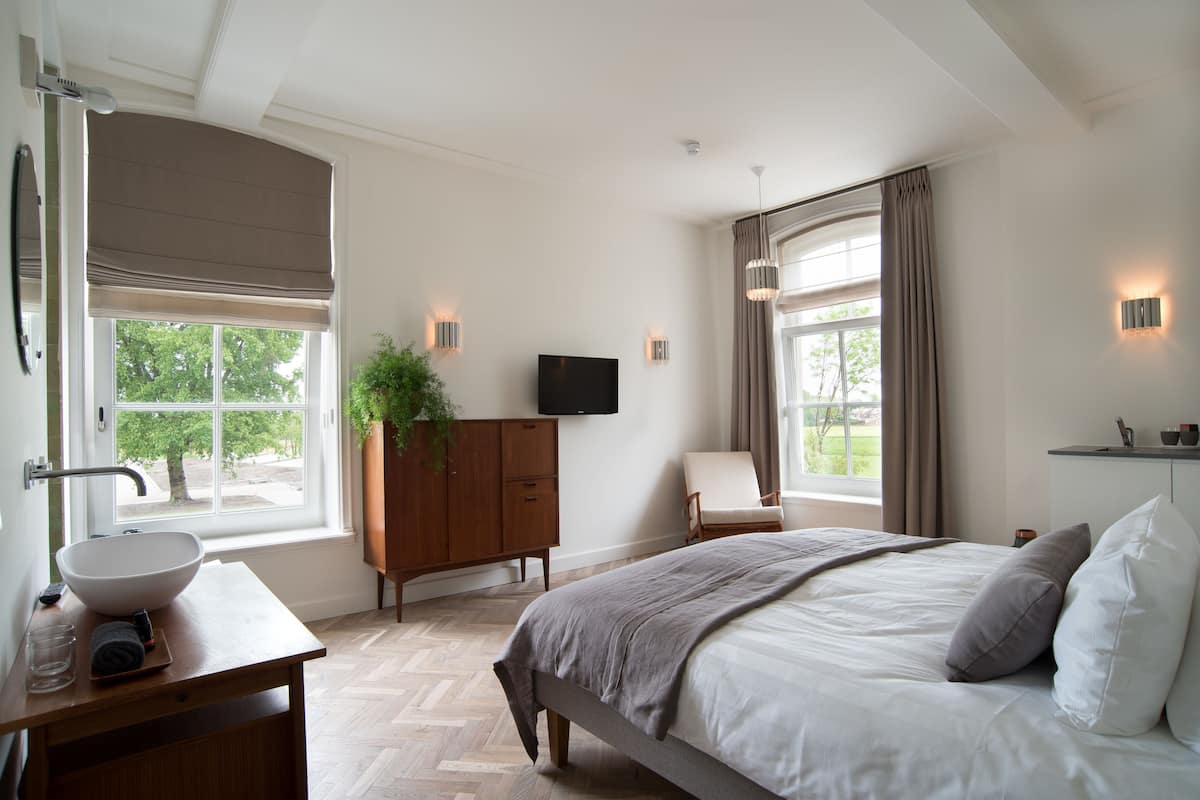 Habitación Deluxe | Escritorio, cunas gratuitas, wifi gratis