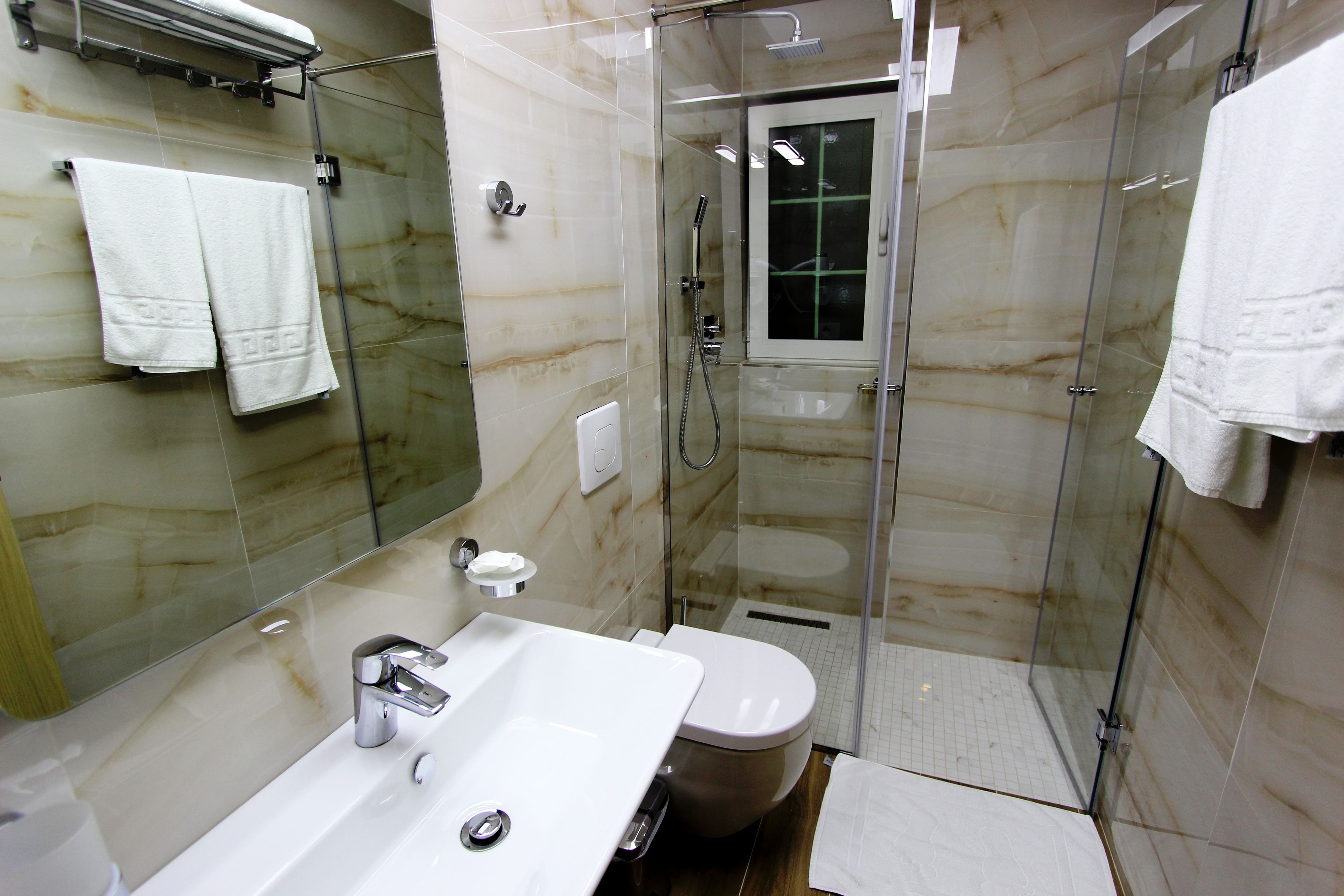 Shower, free toiletries, slippers, towels
