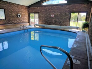 Indoor pool, open 6:00 AM to midnight, pool loungers