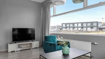 Superior Apartment | Living area | 40-inch TV with satellite channels