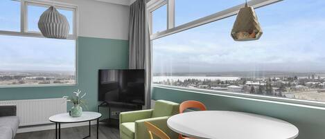 Departamento Confort | Área de sala de estar | Televisión de 40 pulgadas con canales vía satélite