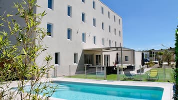 Outdoor pool, open 7:00 AM to 8:30 PM, pool umbrellas, pool loungers