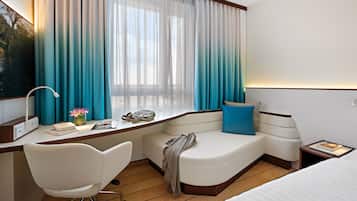 Hypo-allergenic bedding, desk, laptop workspace, blackout curtains