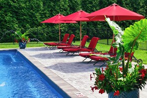 Seasonal outdoor pool, open 8:00 AM to 8:00 PM, pool umbrellas