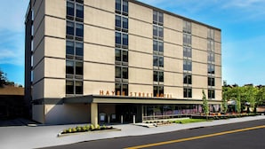 A modern hotel building with a flat facade, large windows, and a clear sign reading 'HAYES STREET HOTEL'. - The Hayes Street Hotel, Trademark Collection by Wyndham (Nashville)