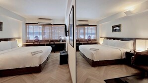 A mirrored hotel room with two beds, a desk, and a chair. - Somewhere to Escape - Hometel (Bangkok)